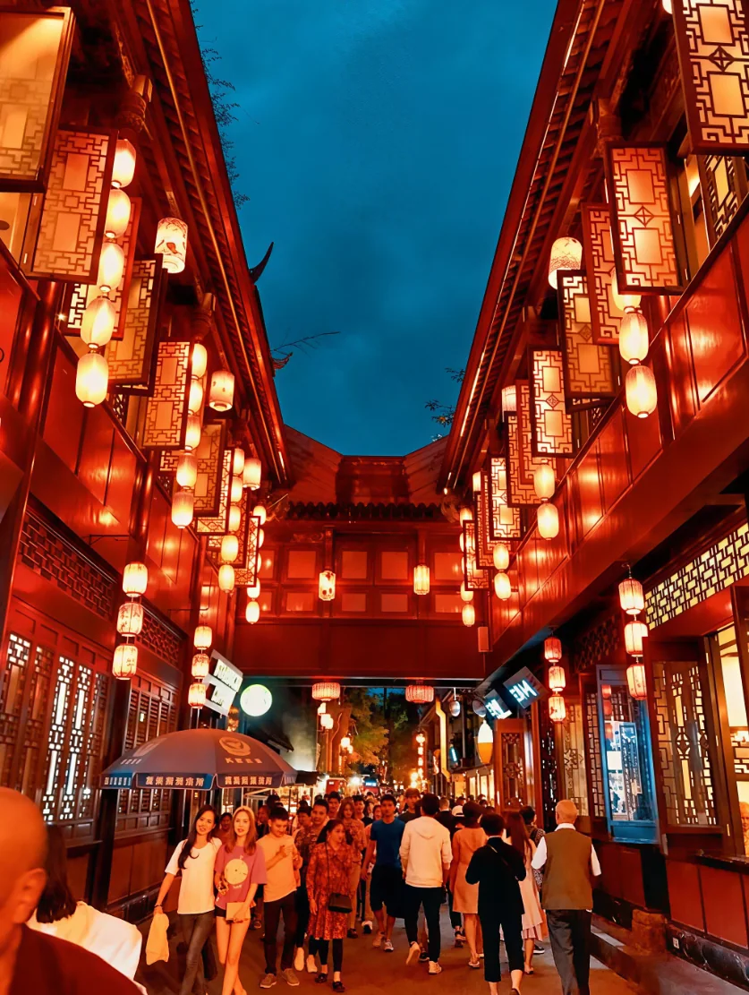 Jinli ancient street at night in Chengdu with red lanterns and calligraphy banner