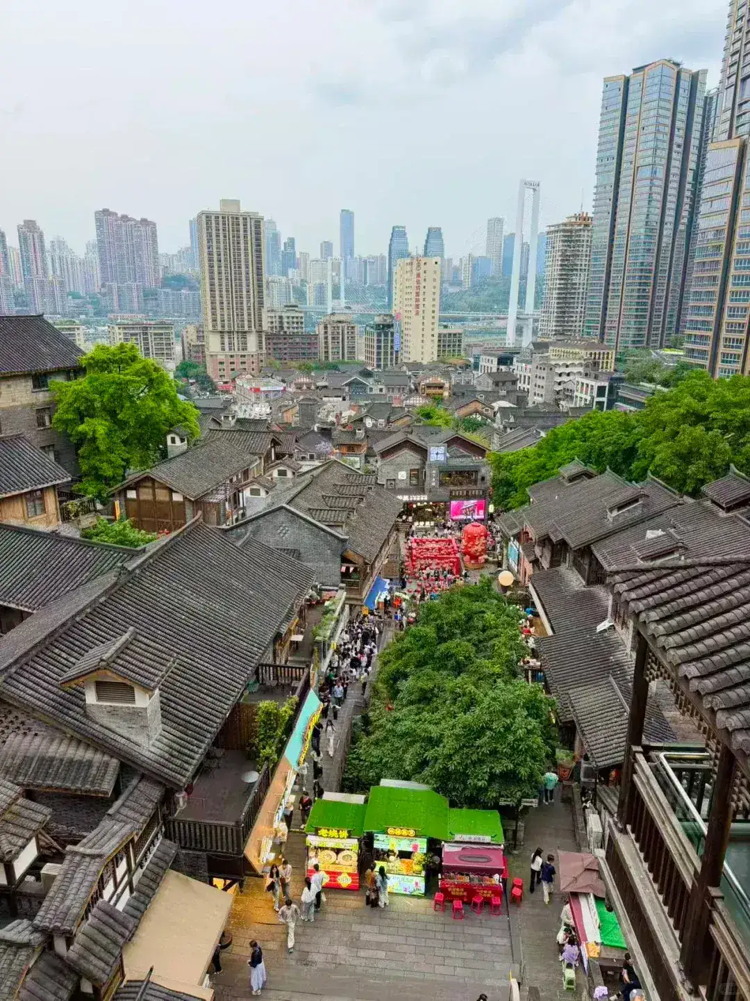 Shibati old street quarter in Chongqing seen from above, grey-tiled roofs against new towers