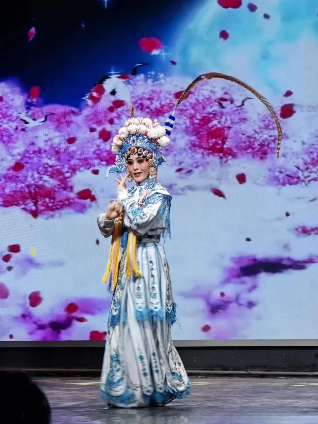 Sichuan opera performer in traditional costume on stage in Chongqing