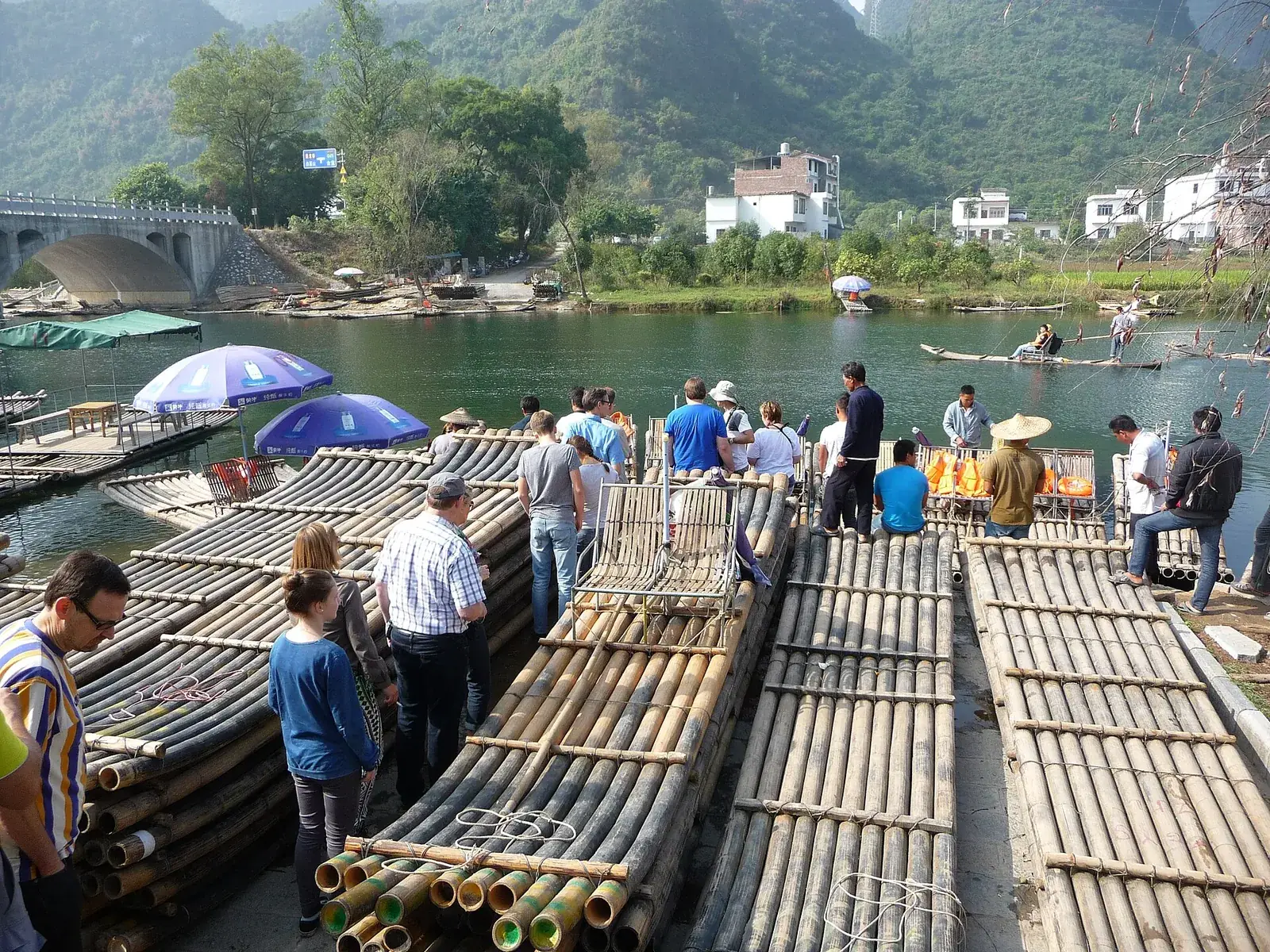 Bamboo rafts on the Yulong River near Yangshuo with karst peaks and green banks