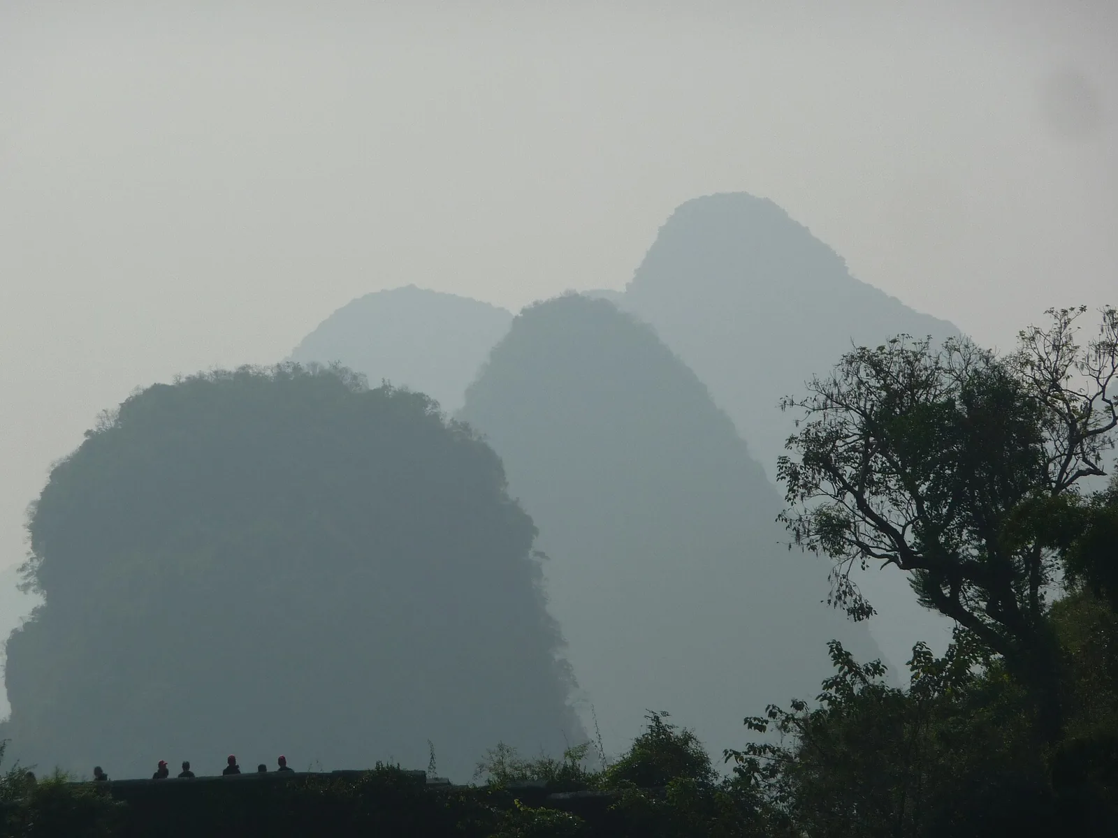 The Yulong River valley with its road bridge and karst peaks outside Yangshuo