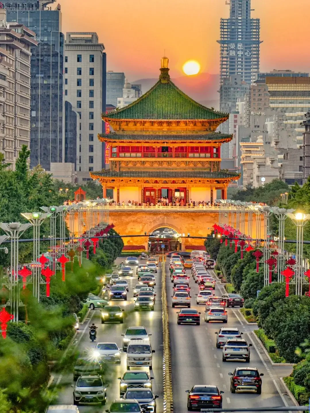 The Xi'an Bell Tower lit at night above the traffic circle